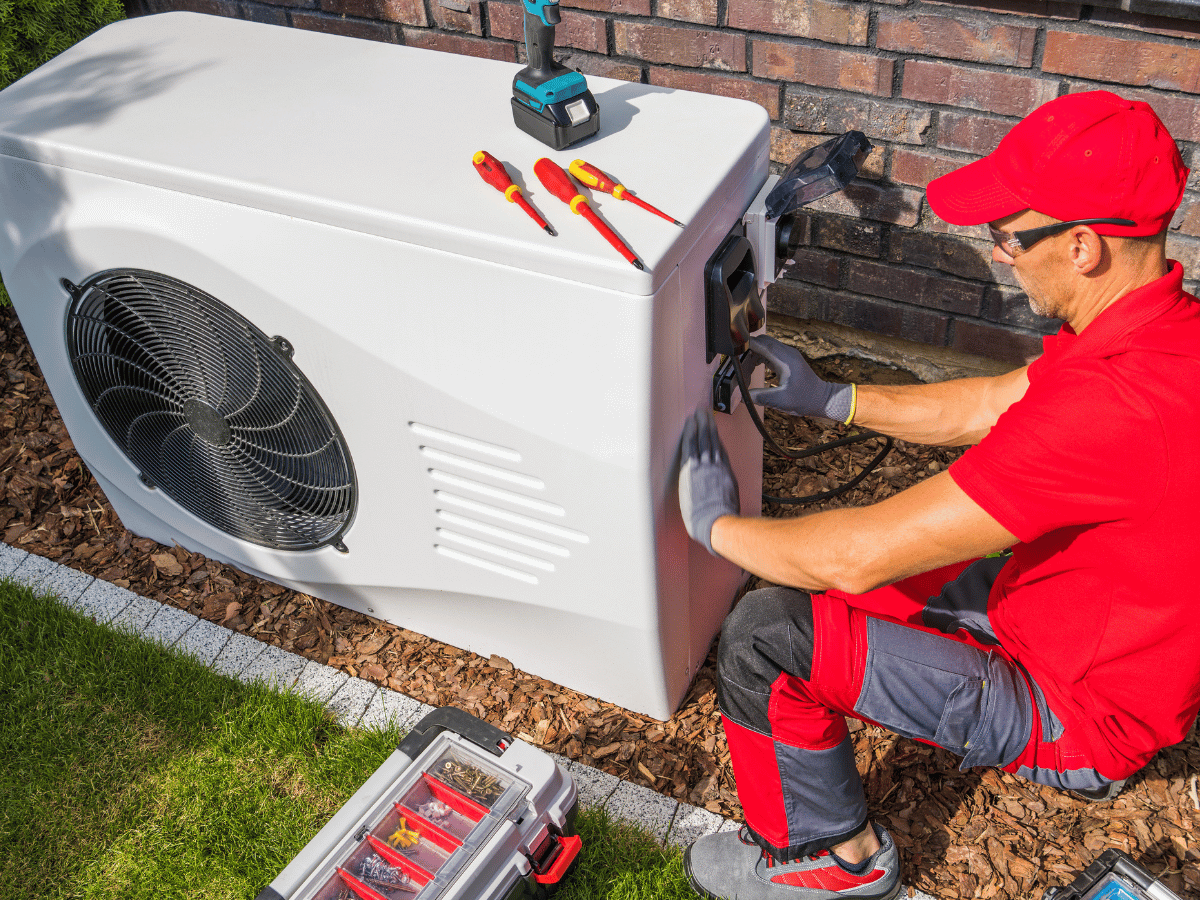 Heat pump installation technician setting up a new energy-efficient heat pump system in Powhatan, VA