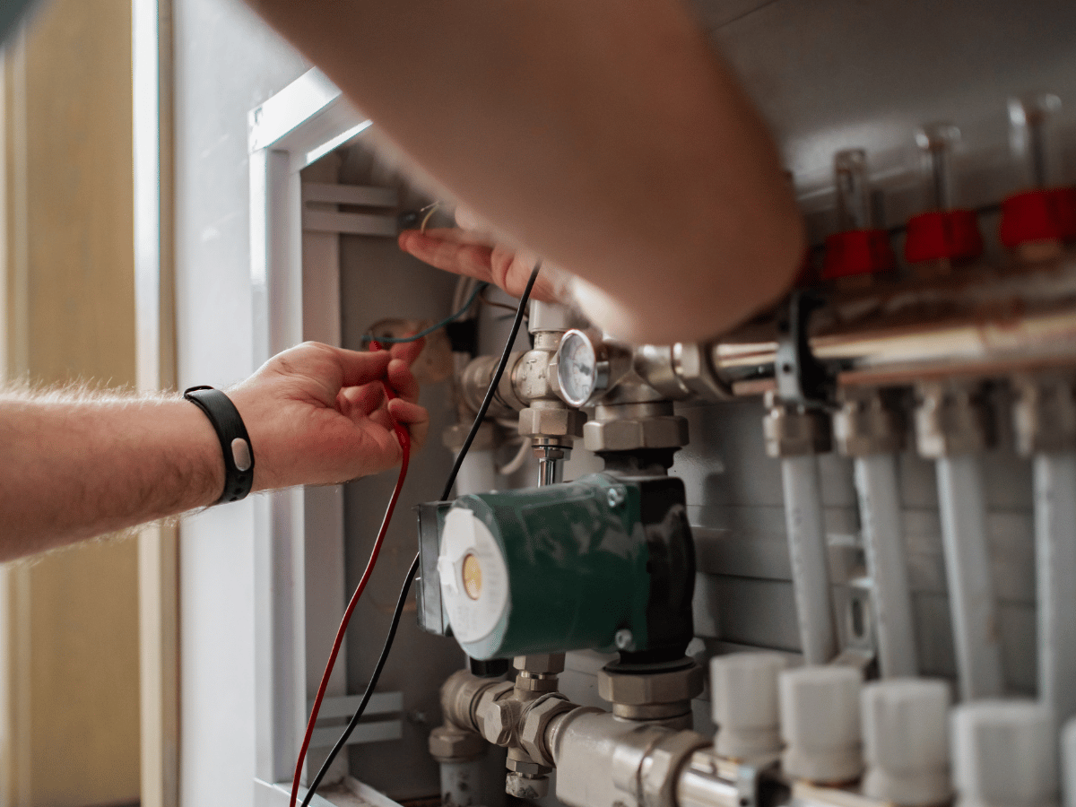 Heat pump repair technician performing system diagnostics and troubleshooting in Powhatan, VA